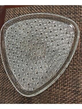 Vintage Anchor Hocking triangular snack plate in the "Daisy and Button" pattern